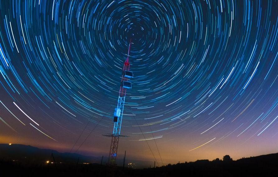 time lapse image of stars moving around sky